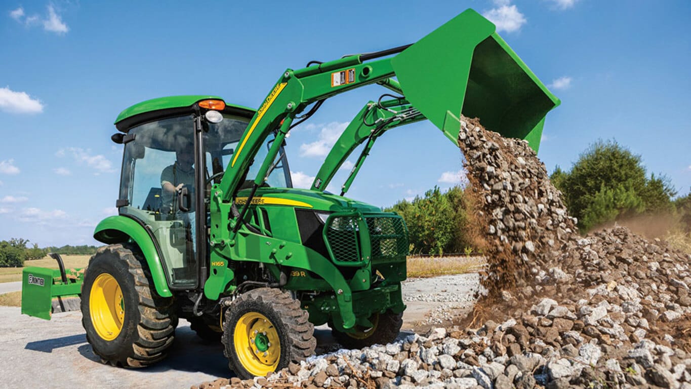 2024 John Deere 3039R tractor using AutoConnect front loader attachment to unlead concrete rocks