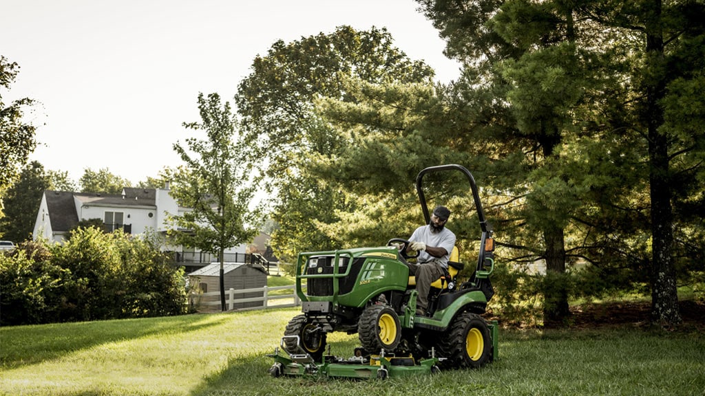 person operating 1025R compact utility tractor