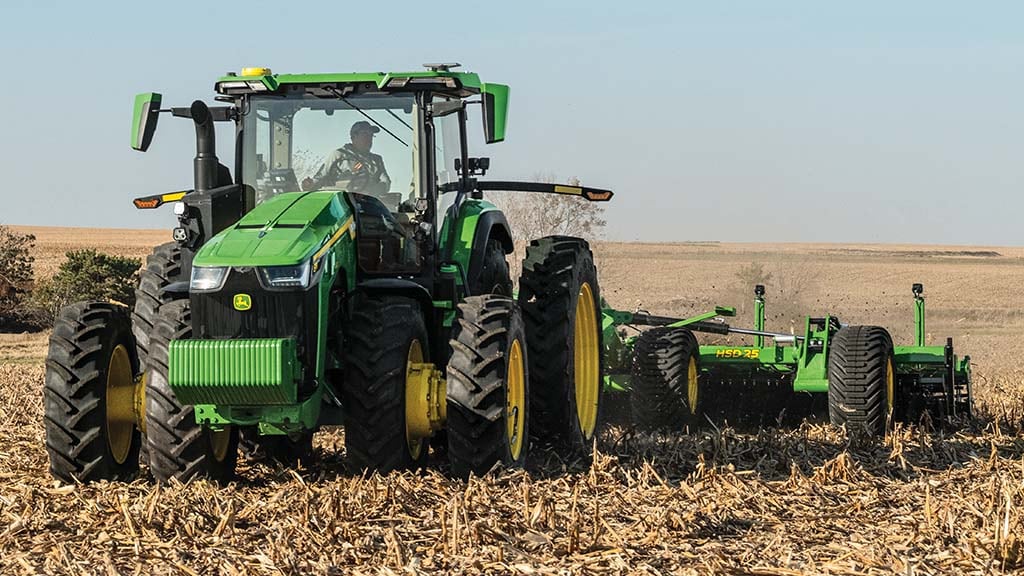 John Deere 8R 410 pulling a HSD25 High Speed Disk in a field