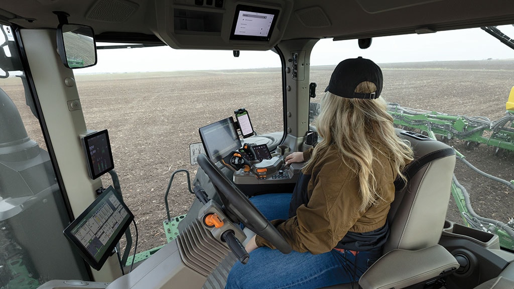 Inside view of a tractor cab of the John Deere Operator Experience