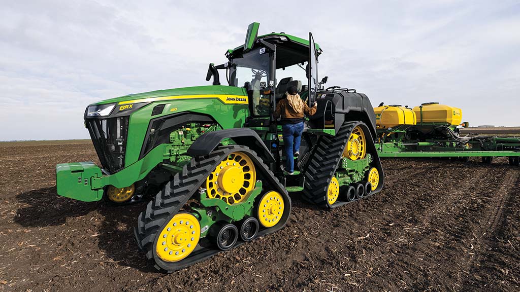 John Deere 8RX 410 pulling a 1775NT Drawn Planter in a field