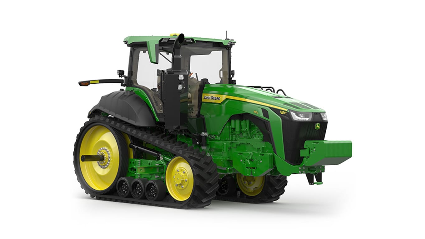 Front-right-facing studio shot of a 2-tracked green tractor on a white background.