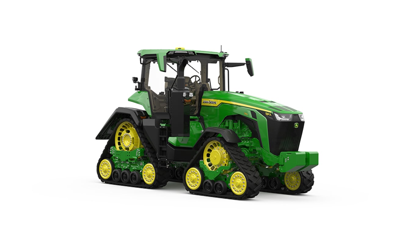 Front-right-facing studio shot of a 4-tracked green tractor on a white background.