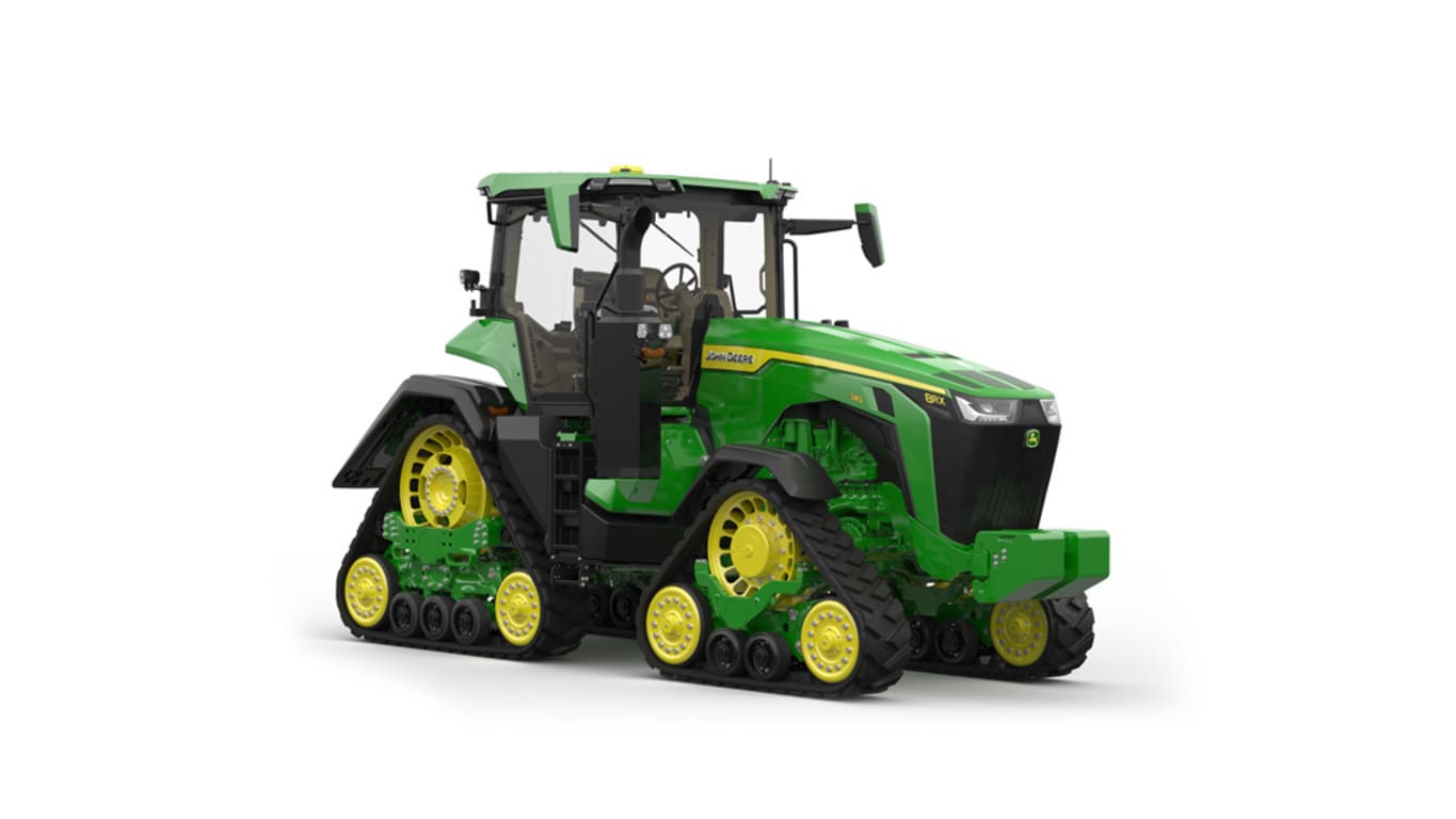 Front-right-facing studio shot of a 4-tracked green tractor on a white background.