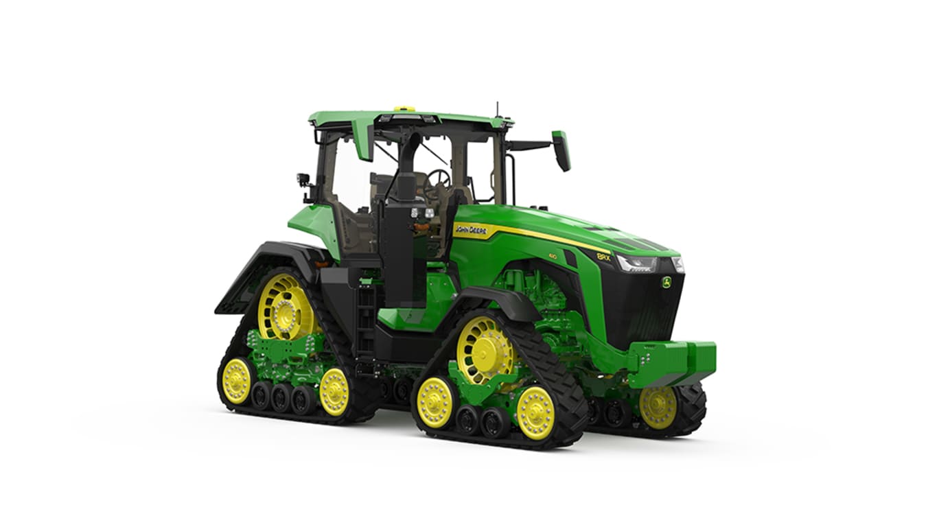 Front-right-facing studio shot of a 4-tracked green tractor on a white background.