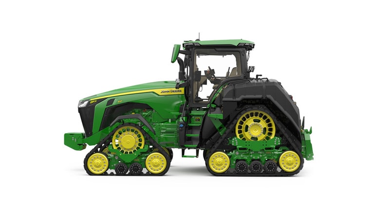 Left-facing studio shot of a 4-tracked green tractor on a white background.