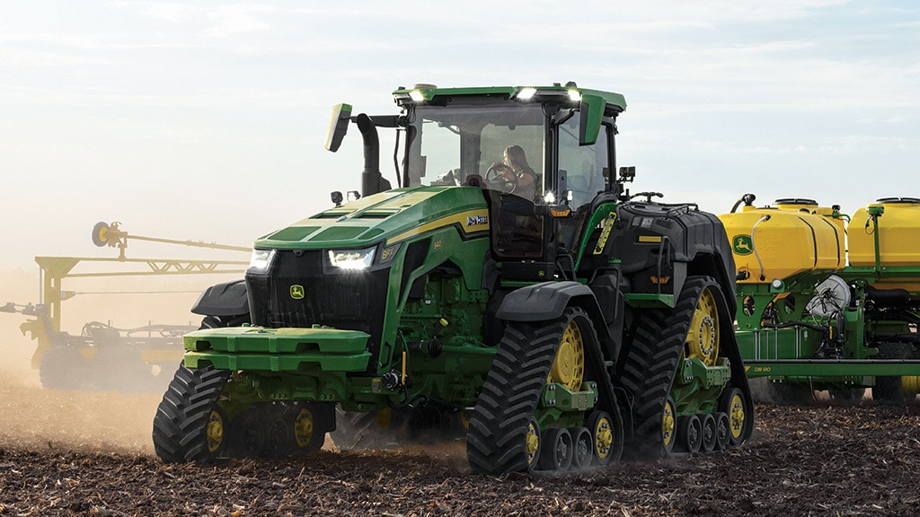 High-horsepower 8RX Tractor planting in a field.