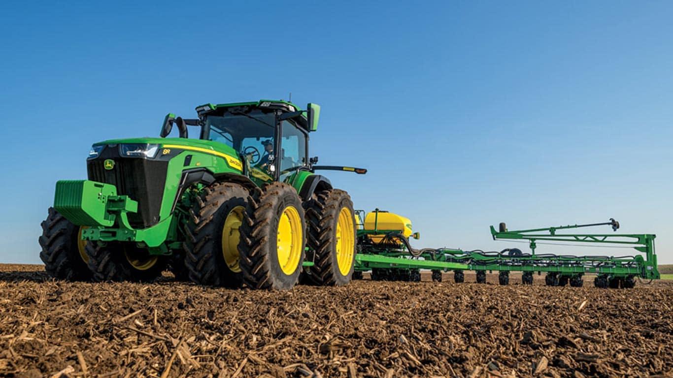 8r tractor in the field