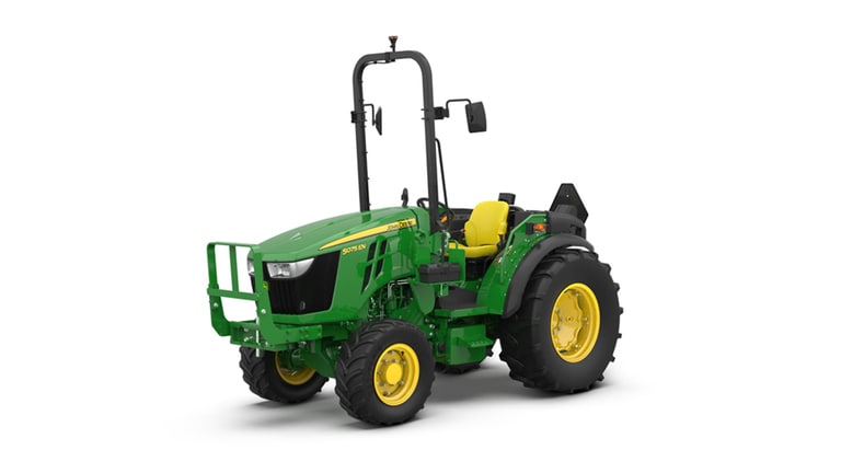 Green John Deere 5075E tractor with yellow seat, roll bar, and large tires on white background.