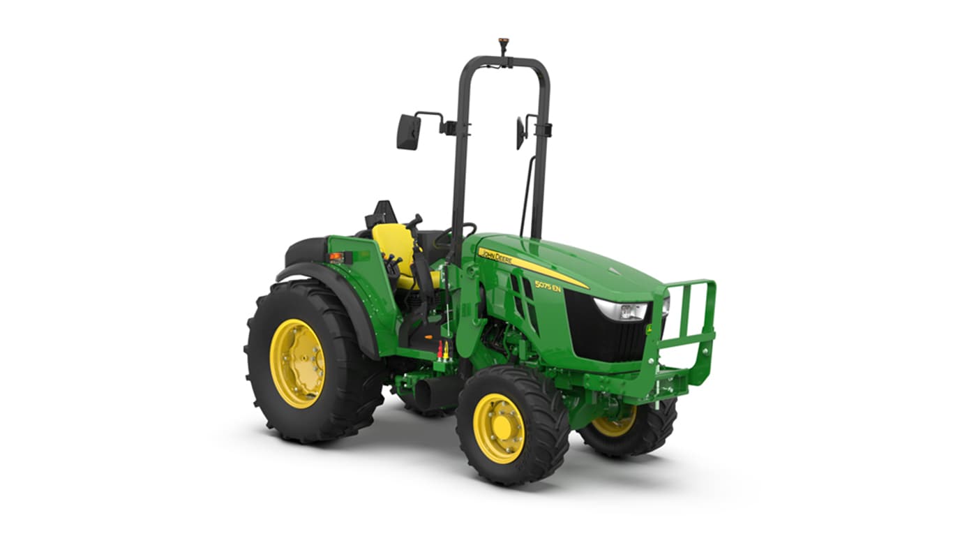 Green John Deere tractor with yellow wheels, black tires, and roll bar on white background