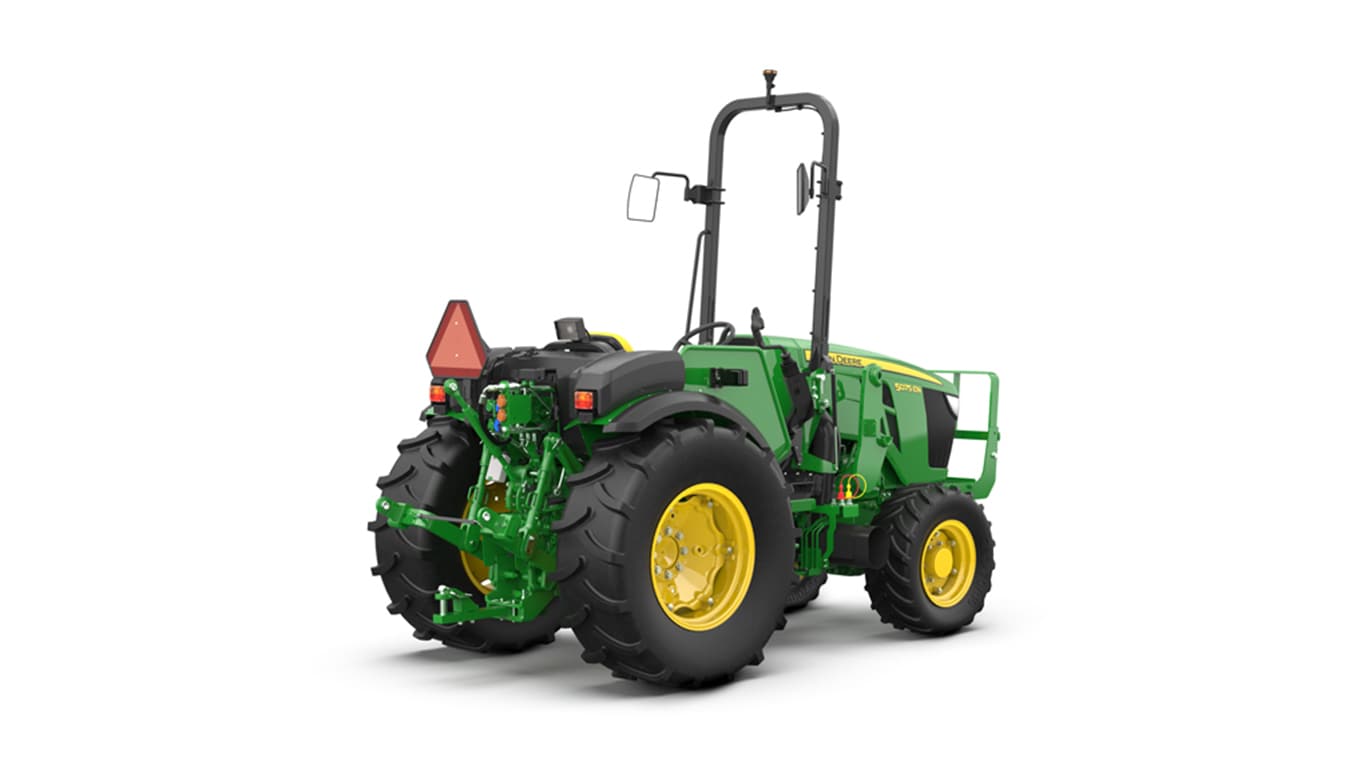 Green and yellow tractor rear view with large tires and triangular slow-moving vehicle sign.