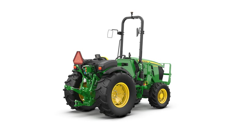 Green and yellow tractor rear view with large tires and triangular slow-moving vehicle sign.