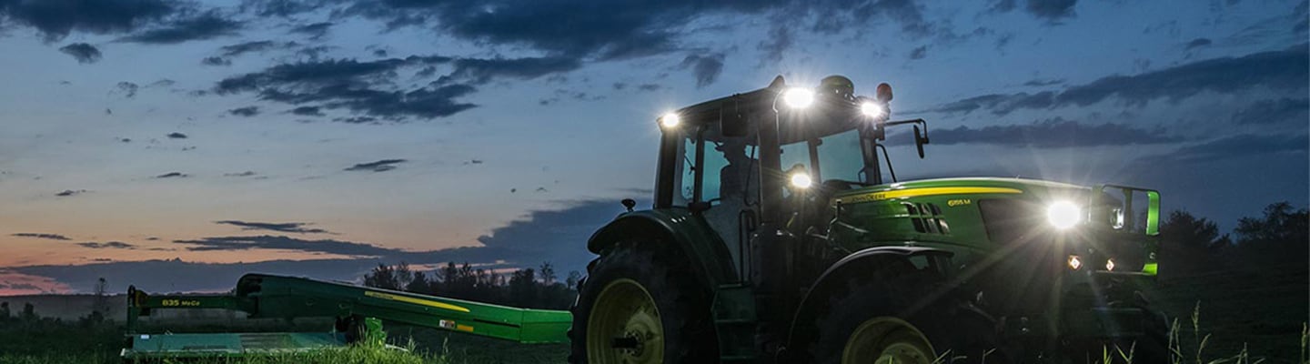 6m tractor in field at night
