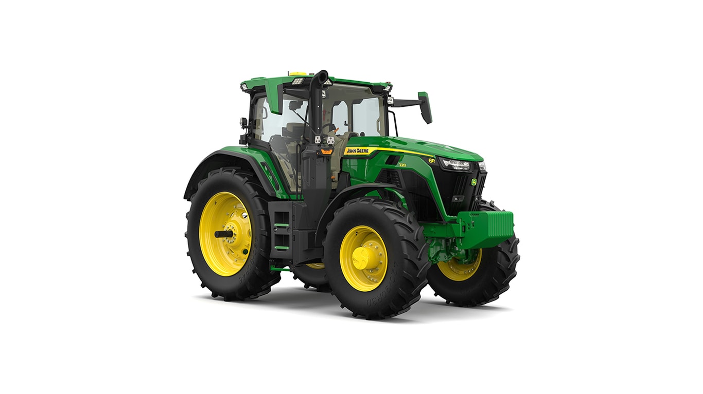 Studio shot of a front-right-facing cabbed green tractor on a white background.