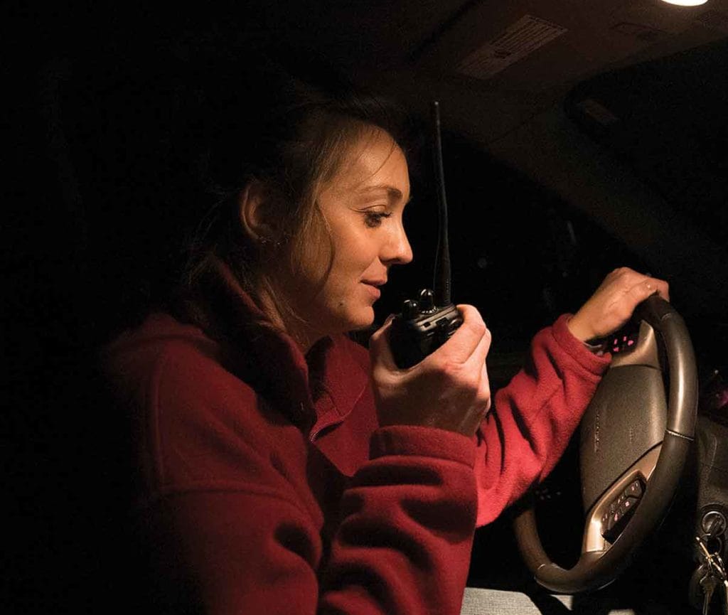 Woman talking in car with device