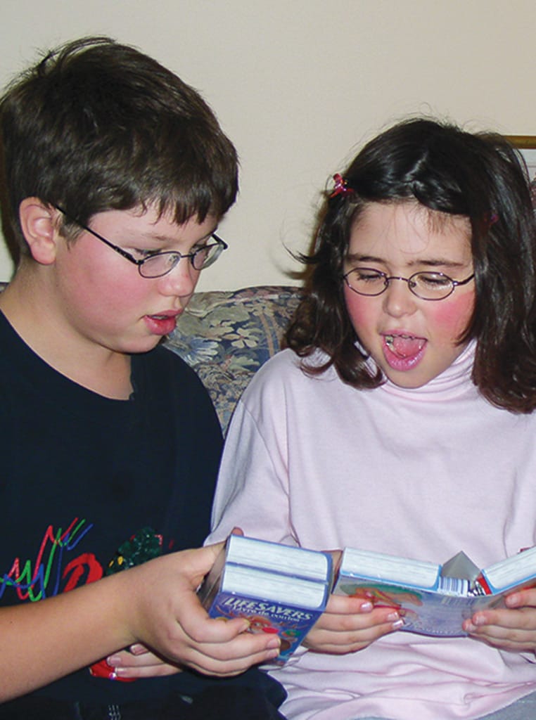 two children opening gifts