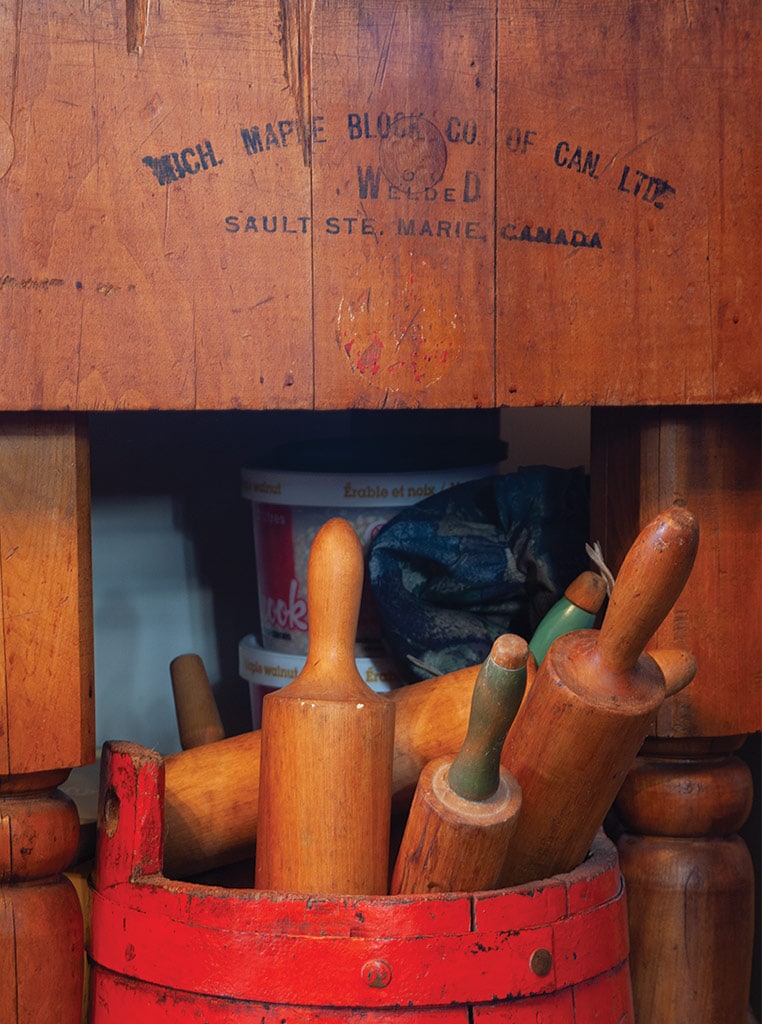 wooden rolling pins in a wooden barrel