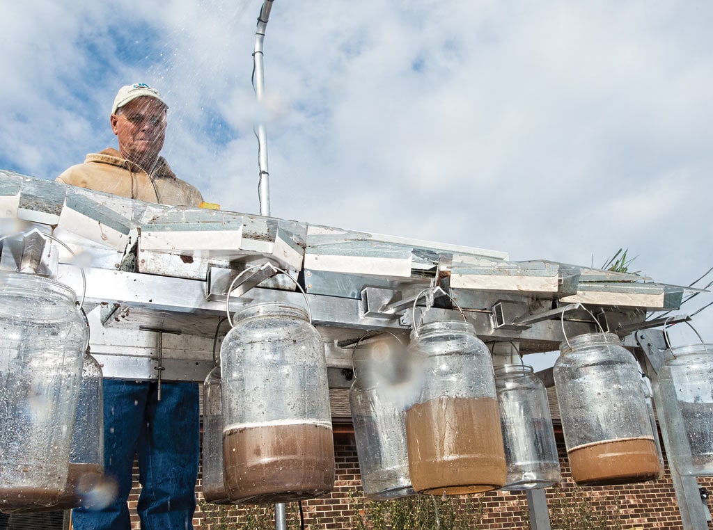 rainfall collector testing with jugs