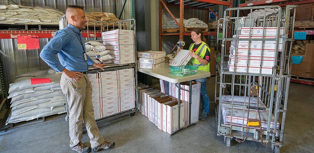 Palouse Postmaster with mail