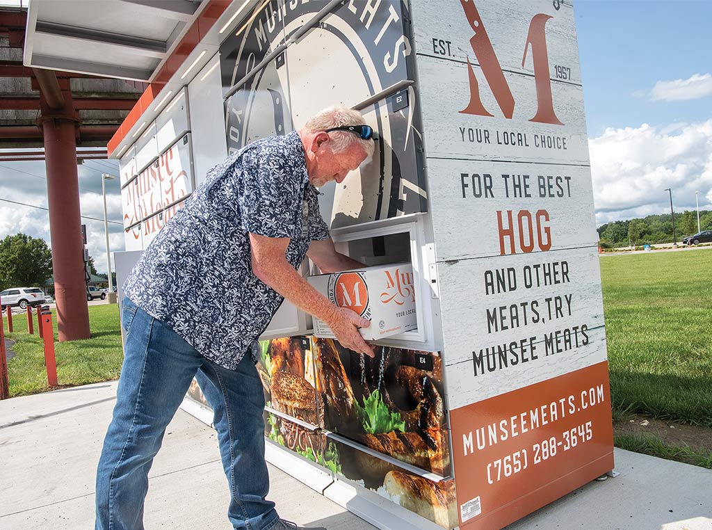 picking up order from self-serve meat locker