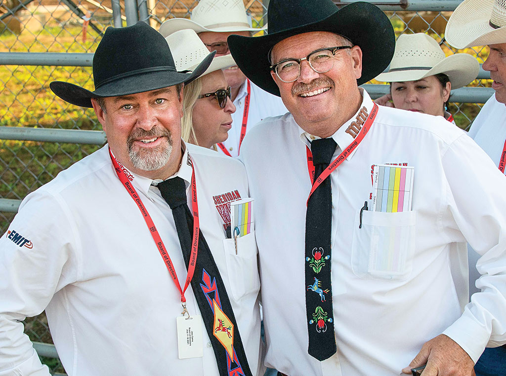 Two men in cowboy hats" title="Two men in cowboy hats