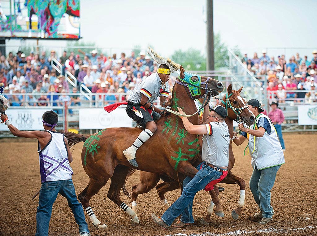 Man on horseback while men intercept