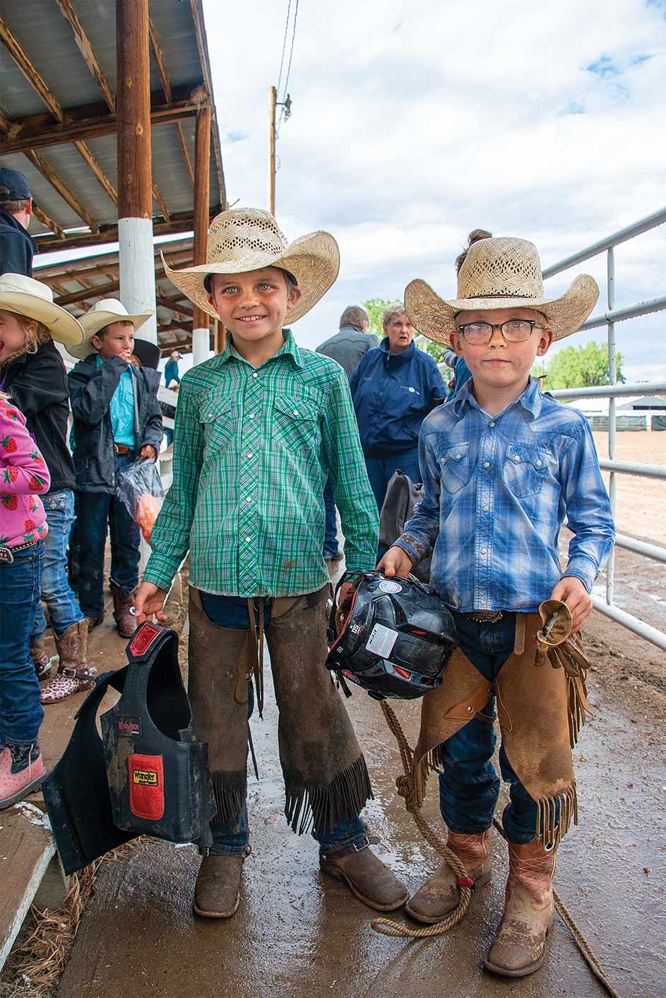 Two young boys dressed for the rodeo