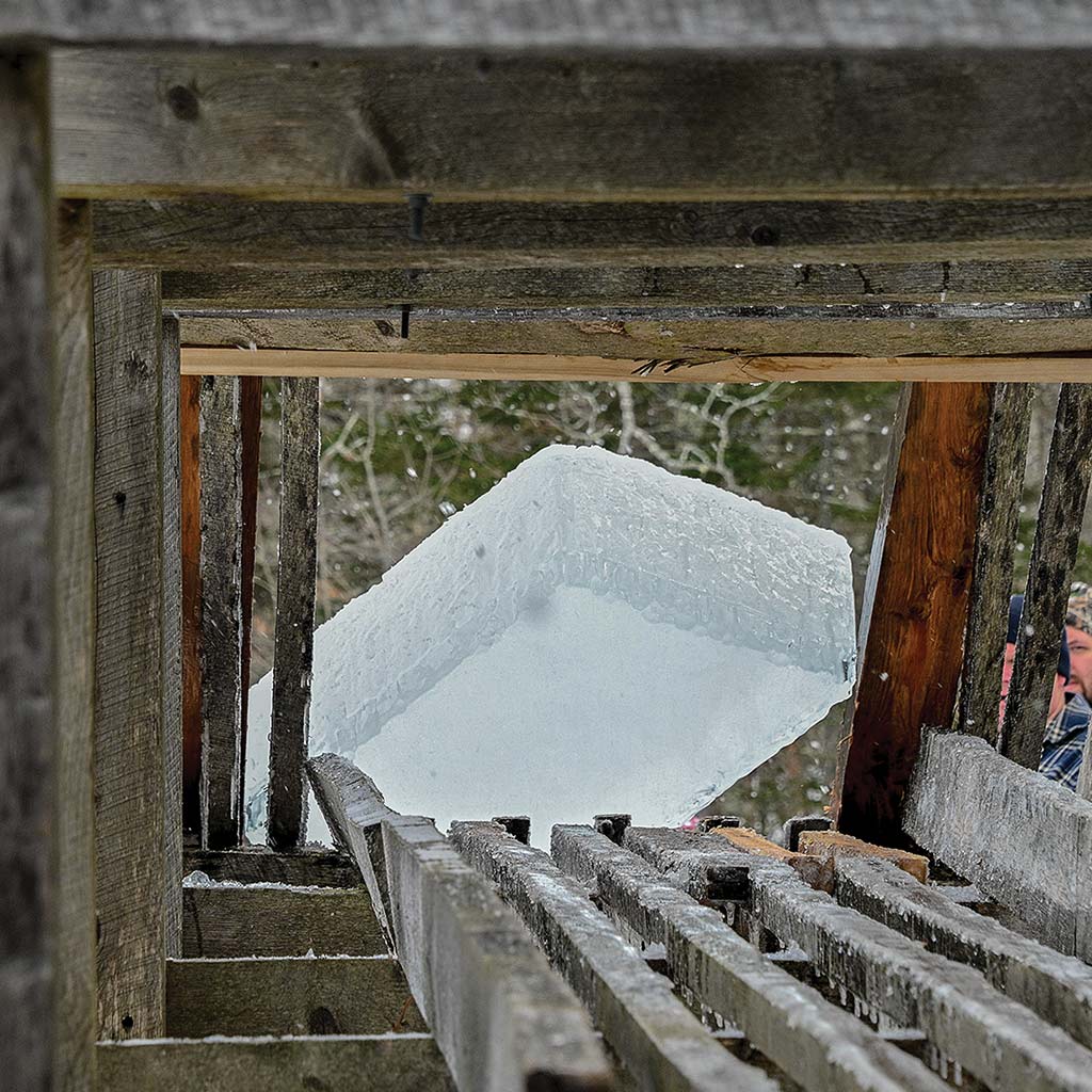 ice block tipping onto the trestle into the ice house