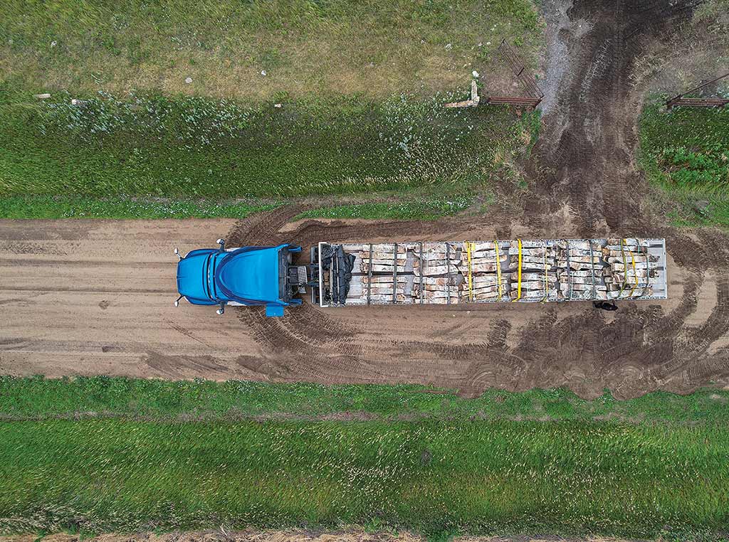 birdseye view of truck carrying limestone fenceposts