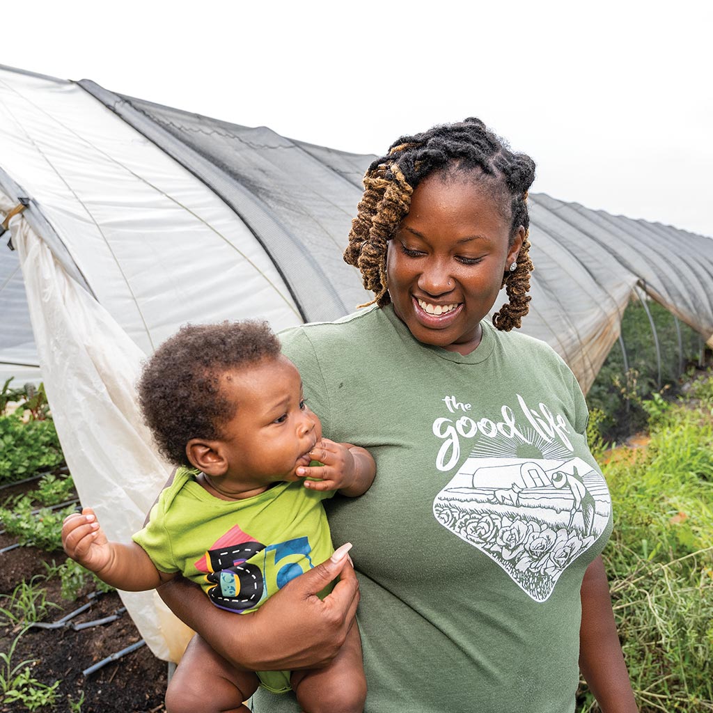 woman and child outside of tent