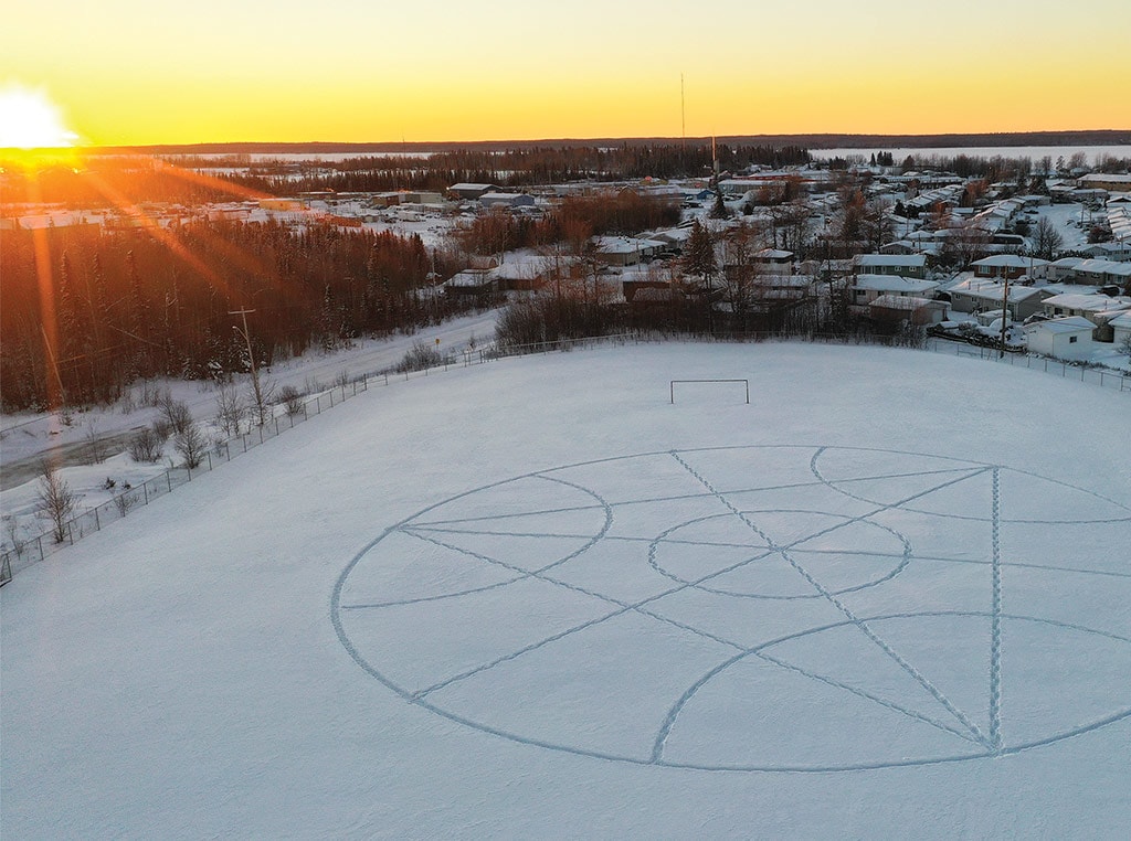Aerial view of snow art at sunset