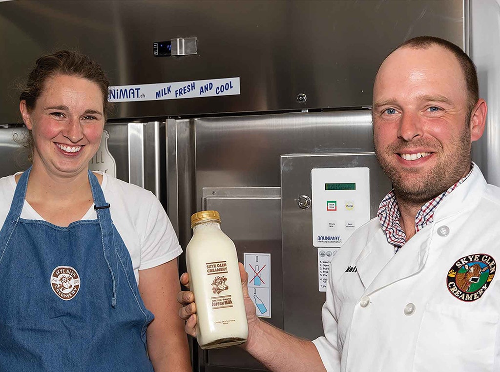 The Brosens presenting a bottle of Skye Glen milk