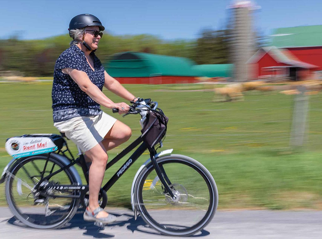 woman riding e-bike