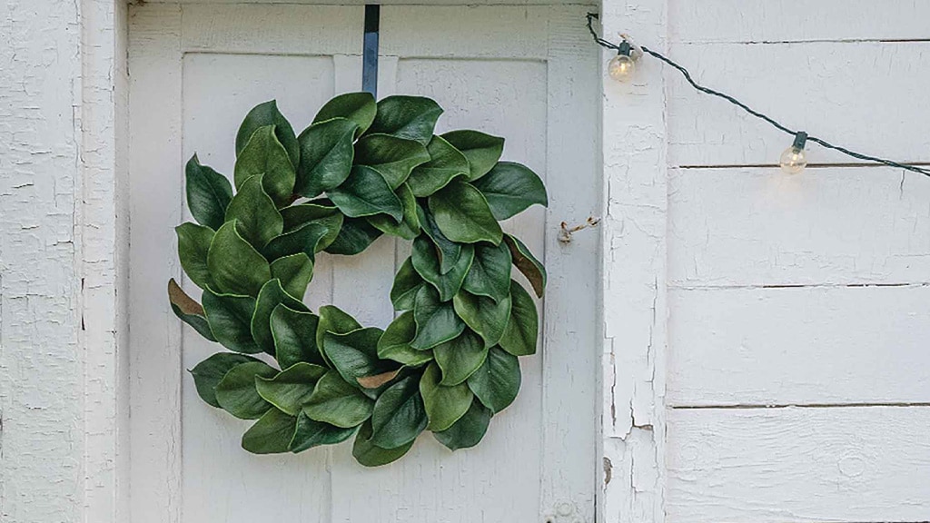 magnolia wreath on old white door