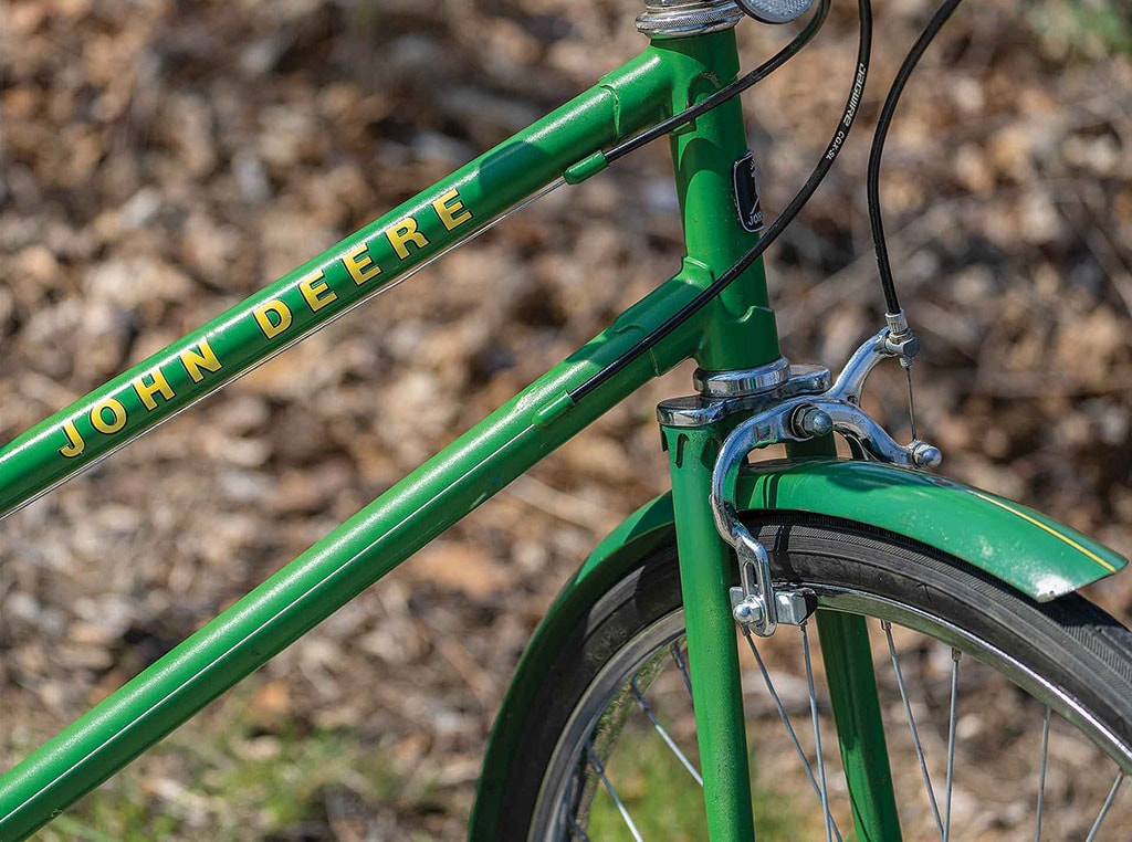 closeup of green John Deere bicycle