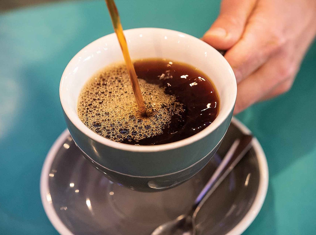 pouring coffee into a mug