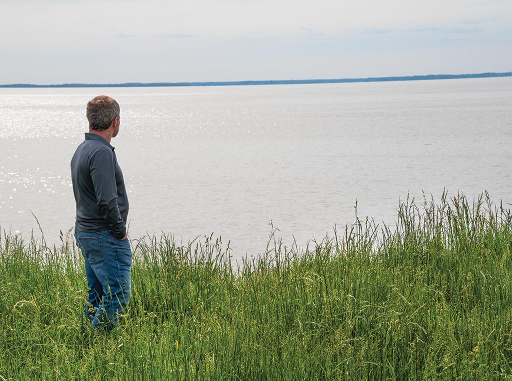 man overlooking ocean