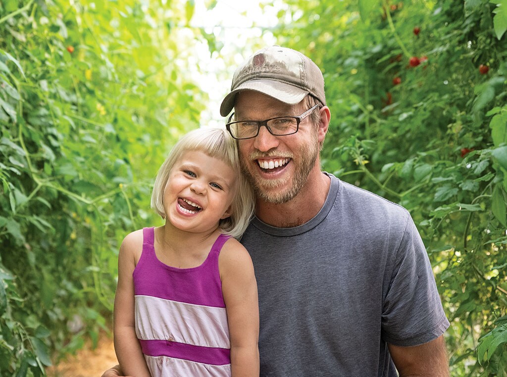 man smiling with little girl