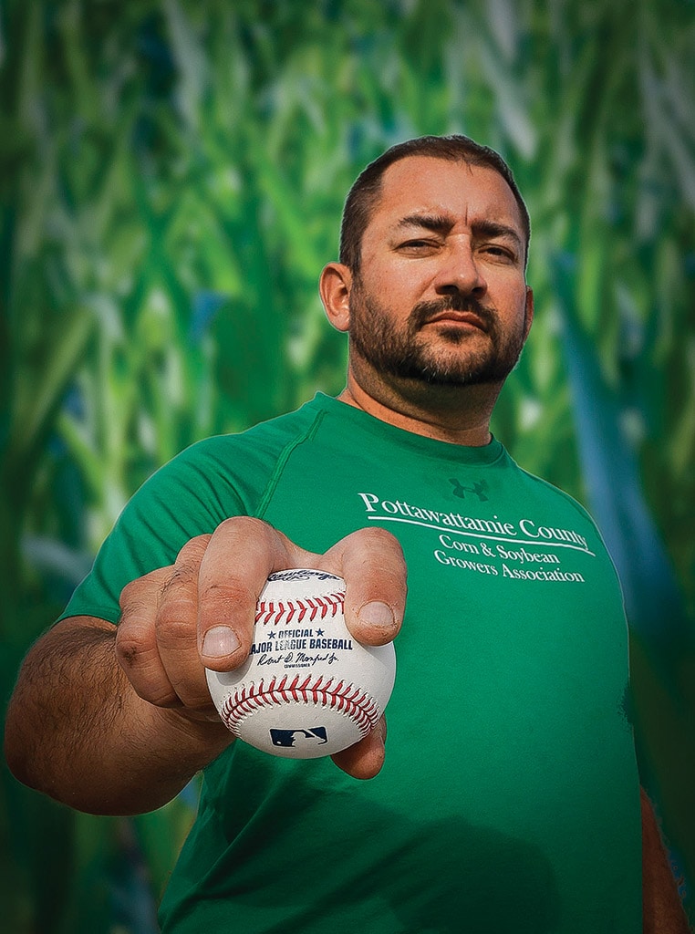 Iowa corn grower Kevin Ross holding a baseball