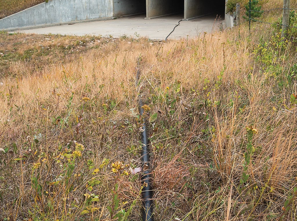 irrigation pipes passing through road underpass