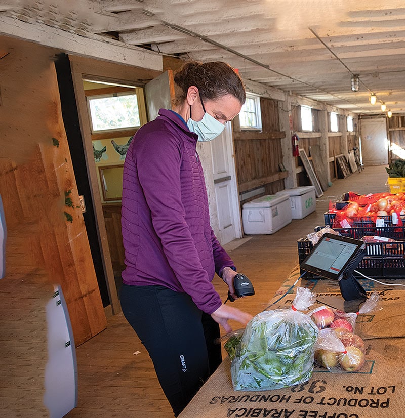 Ginger Reiner scanning produce at farm shop