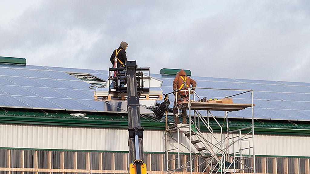 men working on solar panels