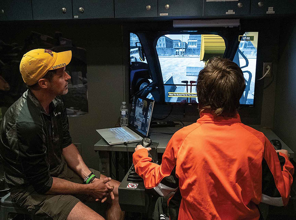 child using the tractor simulator