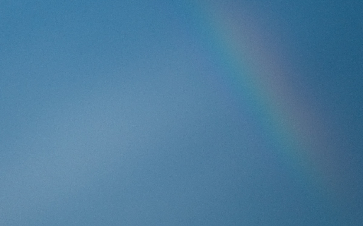 blue sky with rainbow