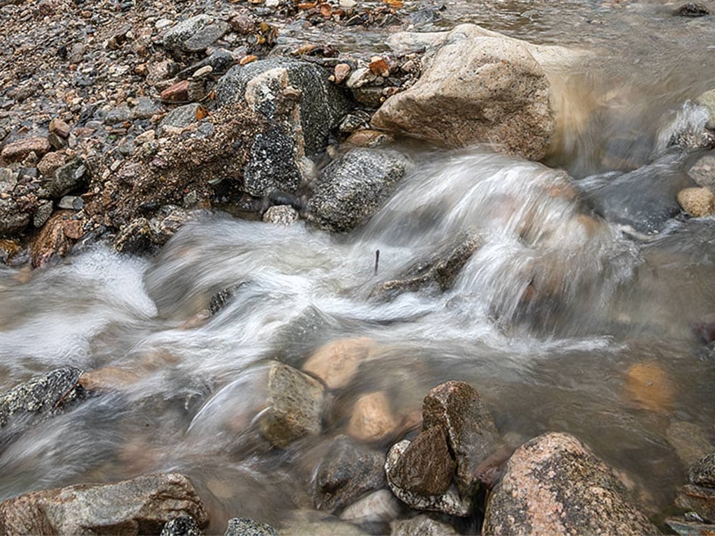  closeup of water rushing over rocks