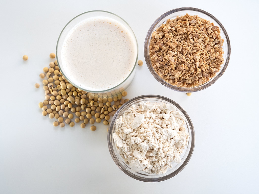 closeup of three soy products in glasses from above