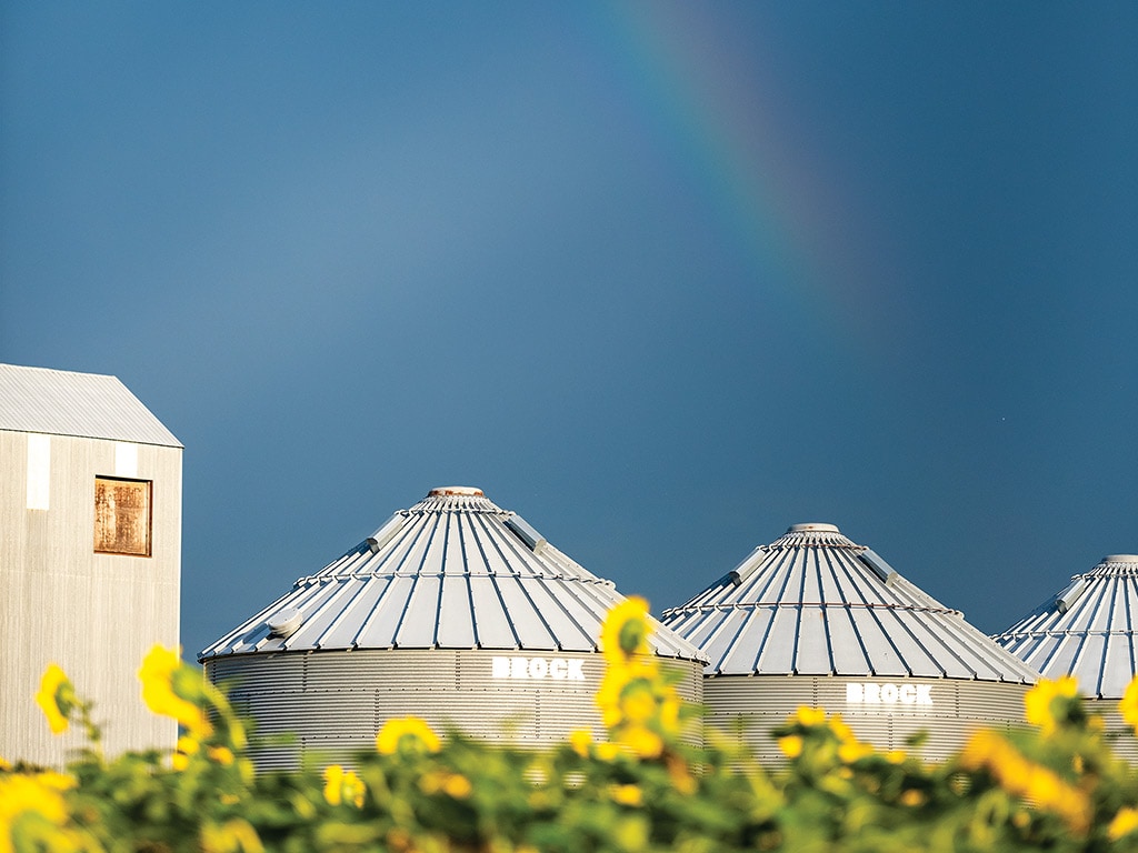 Double rainbow in the sky above the dairy farm