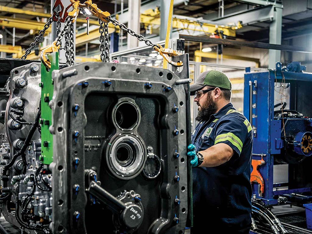 John Deere manufacturing employee in warehouse