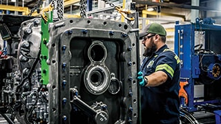 John Deere manufacturing employee in warehouse