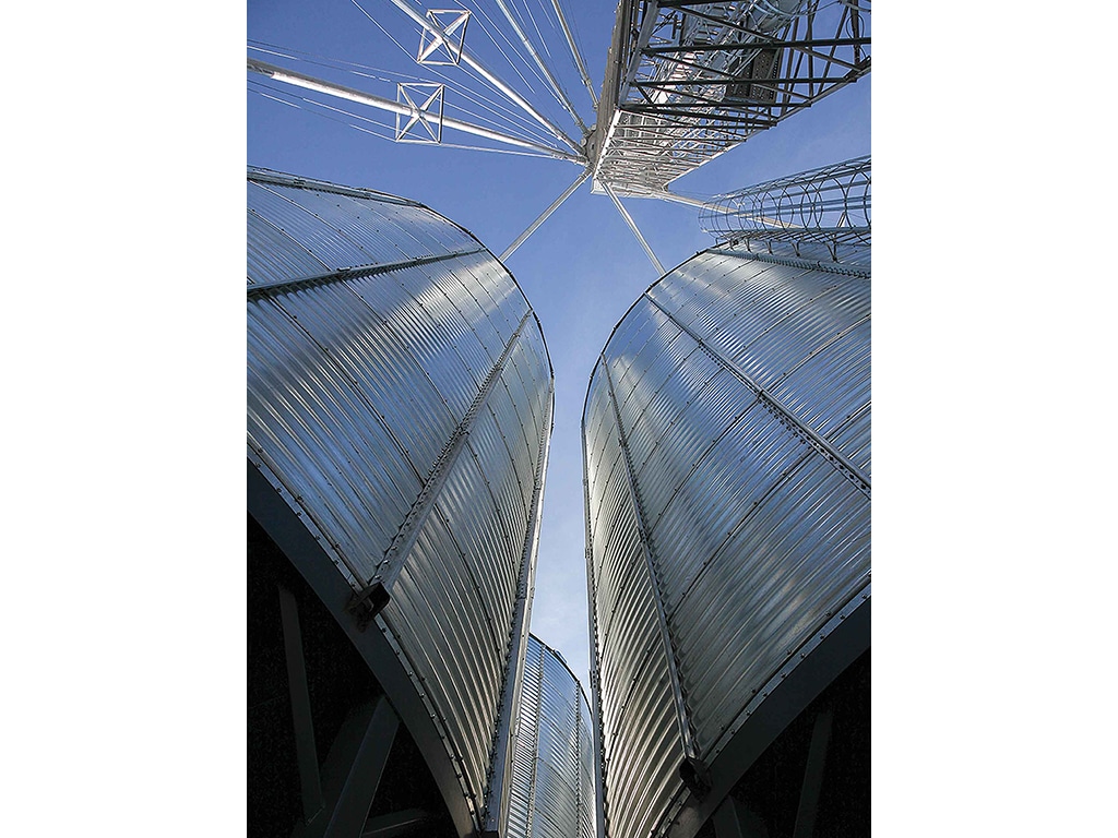 looking up at metal silos